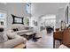 Bright living room with high ceilings and arched entryway adjacent to dining room at 10822 Eagle Crest Ct, Parker, CO 80138