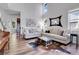 Open living room with high ceilings, large windows, and comfortable seating arrangement at 10822 Eagle Crest Ct, Parker, CO 80138