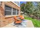 Charming patio with cozy seating, decorative pillows, and serene backyard view at 10822 Eagle Crest Ct, Parker, CO 80138