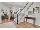 Beautiful staircase with hardwood floors, leading to the upper level, adjoins the home's foyer and living area at 10822 Eagle Crest Ct, Parker, CO 80138