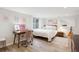 Spacious bedroom with desk, modern lighting, and decor at 1870 S Ogden St, Denver, CO 80210