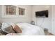Cozy bedroom featuring natural light and simple decor at 1870 S Ogden St, Denver, CO 80210