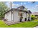 Charming home exterior with a well-maintained lawn and easy access to the basement at 1870 S Ogden St, Denver, CO 80210