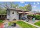 Charming home featuring a covered patio, well-maintained lawn, and inviting curb appeal at 1870 S Ogden St, Denver, CO 80210