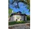 Home featuring a well-manicured lawn, attractive exterior, and welcoming front porch at 1870 S Ogden St, Denver, CO 80210