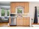 Bright kitchen features modern appliances, white countertops, and wooden cabinets for a clean, updated look at 1870 S Ogden St, Denver, CO 80210