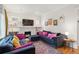 Comfortable living room boasts plush seating, a cozy fireplace, and plenty of natural light at 1870 S Ogden St, Denver, CO 80210