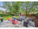 Backyard patio with modern outdoor furniture and lush landscaping creating a relaxing retreat at 1870 S Ogden St, Denver, CO 80210