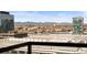 Breathtaking city and mountain views from a high-rise balcony, showcasing the vibrant urban landscape at 1750 Wewatta St # 1825, Denver, CO 80202