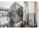 Efficient laundry room with modern washer and dryer units, plus storage space at 1750 Wewatta St # 1825, Denver, CO 80202