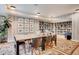 Cozy library with a large table, chairs, and ample bookshelves for reading at 1750 Wewatta St # 1825, Denver, CO 80202
