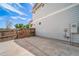 Backyard concrete pad, bordered with a wooden fence, offers ample space for outdoor activities and relaxation at 13152 E 104Th Dr, Commerce City, CO 80022