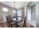 Dining room with wood floors and view to entry door at 13152 E 104Th Dr, Commerce City, CO 80022