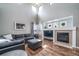 Comfortable living room featuring a fireplace, plush seating, and bright natural light at 13152 E 104Th Dr, Commerce City, CO 80022
