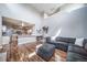 Open floor plan with living room and kitchen area with staircase leading to second floor at 13152 E 104Th Dr, Commerce City, CO 80022