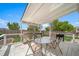 Outdoor patio is perfect for entertaining, complete with dining table, grill, and beautiful backyard at 13152 E 104Th Dr, Commerce City, CO 80022