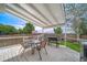 Outdoor patio is perfect for entertaining, complete with dining table, grill, and beautiful backyard at 13152 E 104Th Dr, Commerce City, CO 80022