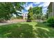 Expansive backyard featuring lush lawn, mature trees, and a charming fence for privacy and a serene outdoor space at 3933 W 102Nd Ave, Westminster, CO 80031