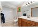 Clean, functional bathroom with a tub, toilet, vanity with sink, and updated lighting and mirror at 3933 W 102Nd Ave, Westminster, CO 80031