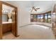 Light filled primary bedroom features a ceiling fan and a window bench with backyard views at 3933 W 102Nd Ave, Westminster, CO 80031