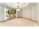 Spacious dining room with large window, tray ceiling, decorative light fixture at 3933 W 102Nd Ave, Westminster, CO 80031