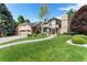 Charming brick home with well-manicured lawn, beautiful landscaping, and attached garage at 3933 W 102Nd Ave, Westminster, CO 80031