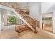 Grand foyer featuring a sweeping staircase, tile floors, and plenty of natural light at 3933 W 102Nd Ave, Westminster, CO 80031