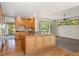 Well-equipped kitchen with island, ample cabinets, and hardwood floors at 3933 W 102Nd Ave, Westminster, CO 80031