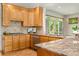 Gourmet kitchen with stainless steel appliances, granite countertops, and tile backsplash at 3933 W 102Nd Ave, Westminster, CO 80031