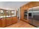 Modern kitchen with stainless steel appliances, granite countertops, and hardwood floors at 3933 W 102Nd Ave, Westminster, CO 80031