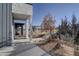 A welcoming front yard with professional landscaping and a charming covered entryway at 1732 Stable View Dr, Castle Pines, CO 80108