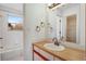 Bathroom with a tub, vanity, mirror and bright light at 13025 W 63Rd Pl # C, Arvada, CO 80004