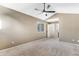 Bright bedroom with a ceiling fan, neutral walls, and a large window at 13025 W 63Rd Pl # C, Arvada, CO 80004