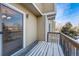 Wooden deck covered in snow, offering an outdoor space with a view of neighborhood at 13025 W 63Rd Pl # C, Arvada, CO 80004