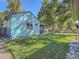 Charming teal home exterior with a well-maintained lawn at 879 S Hudson St, Denver, CO 80246