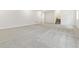 Expansive basement area with neutral walls and plush carpeting at 5726 N Jebel Way, Aurora, CO 80019