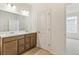 Bathroom with a double vanity and lots of natural light at 5726 N Jebel Way, Aurora, CO 80019