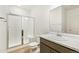 A stylish bathroom featuring a glass-enclosed shower and modern vanity at 5726 N Jebel Way, Aurora, CO 80019