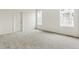 Bright bedroom with large windows and neutral carpeting at 5726 N Jebel Way, Aurora, CO 80019