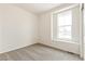 This bedroom offers neutral walls, soft carpet, and a well-lit window at 5726 N Jebel Way, Aurora, CO 80019