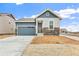 Charming single-Gathering home featuring blue siding, stone accents, and an attached two-car garage at 5726 N Jebel Way, Aurora, CO 80019