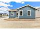 Charming blue single-story home features bright windows and a modern design at 5726 N Jebel Way, Aurora, CO 80019