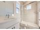 Bright bathroom featuring a modern vanity, glass-enclosed shower, and neutral tile at 11452 Autumn Moon St, Littleton, CO 80125