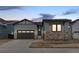 Charming two-story home featuring stone accents, a two-car garage and inviting curb appeal at 11452 Autumn Moon St, Littleton, CO 80125