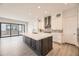 Open kitchen with large island, ample cabinet space, and stainless steel appliances at 11452 Autumn Moon St, Littleton, CO 80125
