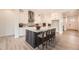 Spacious kitchen with an island, light countertops, and hardwood flooring at 11452 Autumn Moon St, Littleton, CO 80125