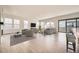 Bright and spacious living room featuring large windows, neutral tones, and modern decor at 11452 Autumn Moon St, Littleton, CO 80125