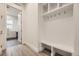 Well-organized mudroom featuring built-in storage, a bench, and coat hooks at 11452 Autumn Moon St, Littleton, CO 80125