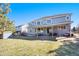 Expansive backyard with a covered patio, mature landscaping, and ample space for outdoor activities at 23453 Painted Hills St, Parker, CO 80138