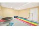 Finished basement featuring play equipment and colorful foam tiles at 23453 Painted Hills St, Parker, CO 80138